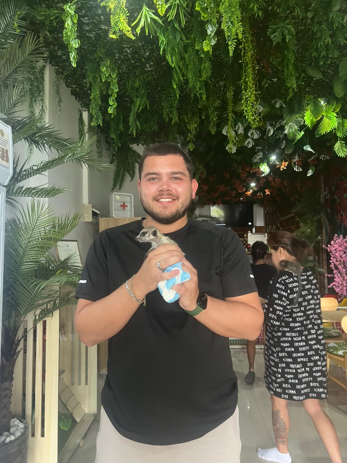 Beavers Animal Cafe meerkat interaction with kids Thailand